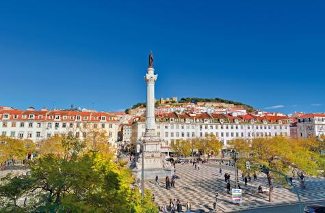 View of Rossio Square and Lisbon castle.