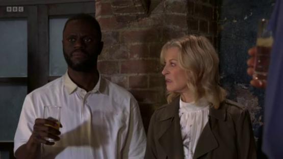 EastEnders scene with two characters.