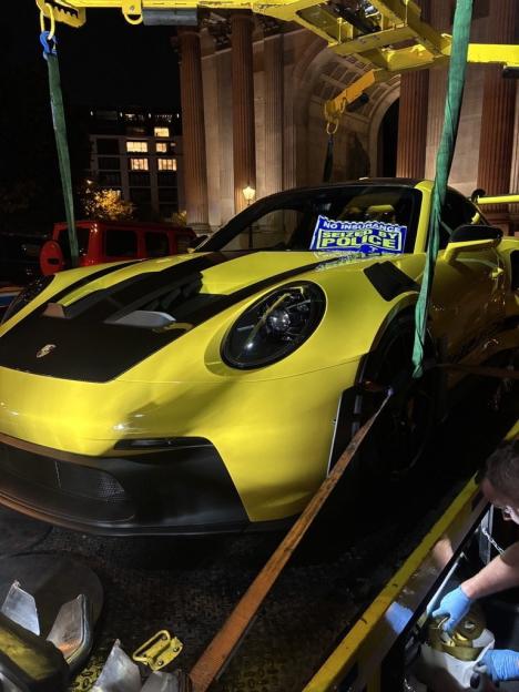 Yellow Porsche seized by police for lack of insurance.