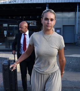 Molly Mae and Tommy Fury arriving at an airport.