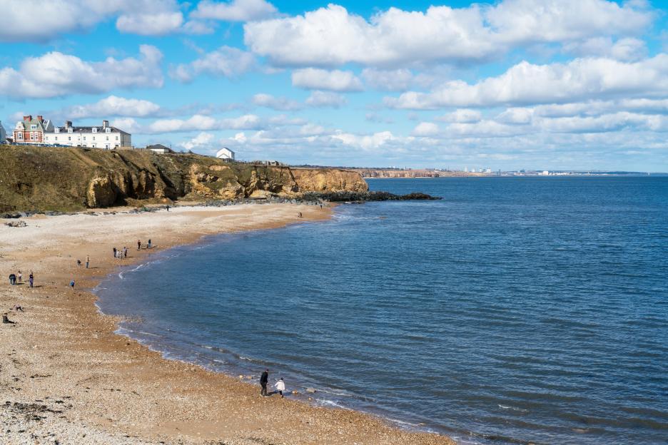 Seaham beach in County Durham, England, with people enjoying the shore.