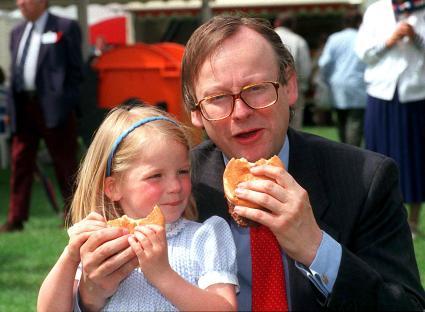Agriculture Minister John Selwyn Gummer feeds his daughter a burger in 1990 to insist they are safe