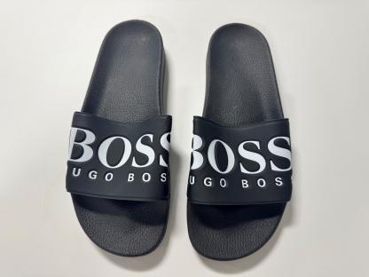 Pair of black Hugo Boss slides.