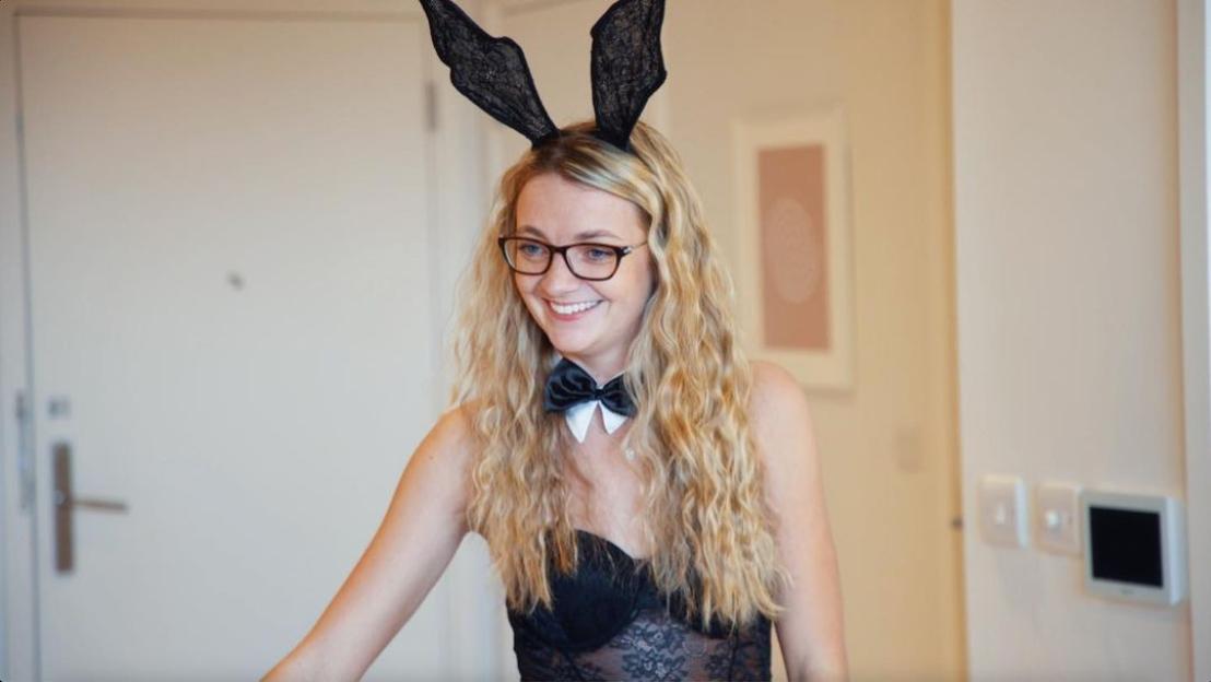a woman wearing bunny ears and a bow tie
