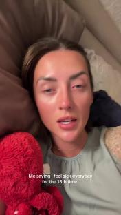 A woman lying in bed looking unwell, holding a red plush octopus. Text overlay reads,