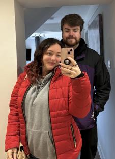 A woman and man taking a selfie.