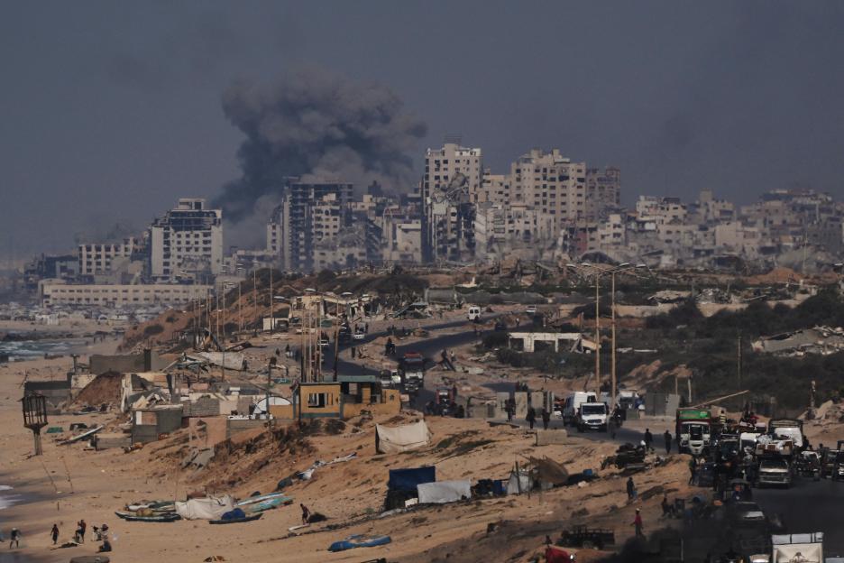 Smoke rises from buildings in Gaza City after an Israeli military strike.