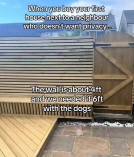 Six-foot-high wooden fence built to contain dogs.