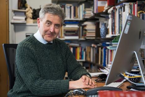 Professor Nicholas Vincent sitting at his desk.