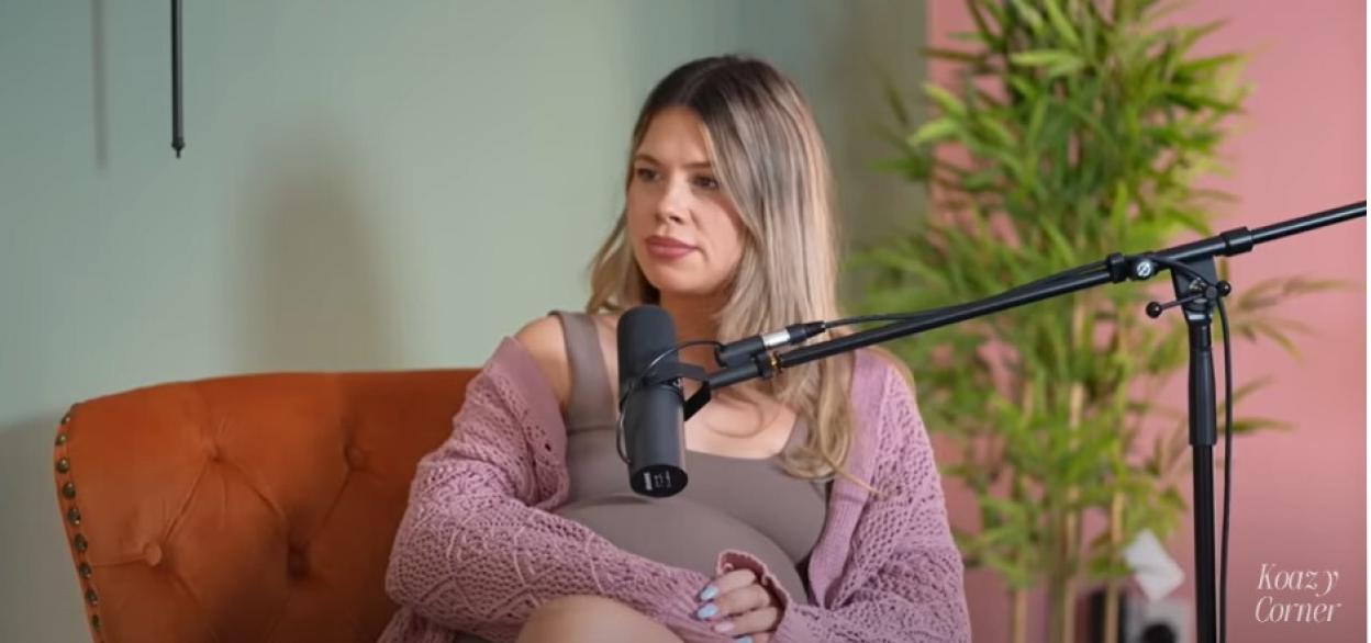 A pregnant influencer being interviewed.
