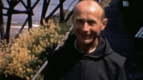 Father Thaddeus Kotik at Caldey Island abbey ruins.