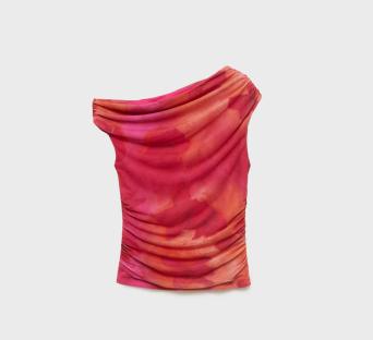 One-shoulder pink and orange top.