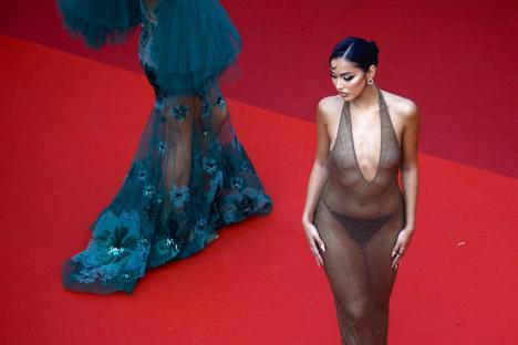 Cindy Kimberly at the Cannes Film Festival wearing a sheer brown gown.