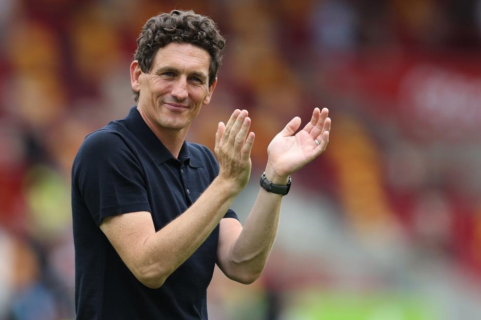 Brentford manager Keith Andrews applauds fans.