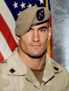 Pat Tillman in Army uniform carrying a guidon.