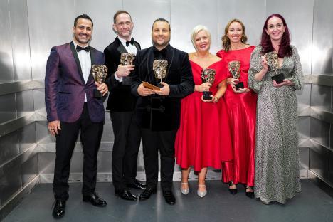 Ash Palmisciano and the Emmerdale cast accepting a Serial Drama award.