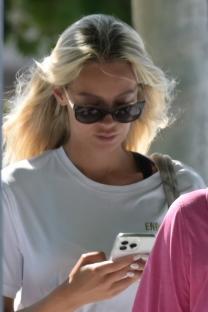 Nicoline Artursson looking at her phone.