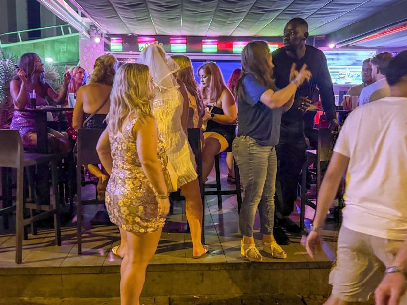 Revellers at a bar.