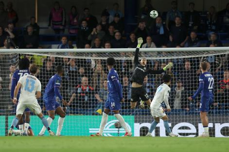 Chelsea's goalkeeper making a save during a soccer match.