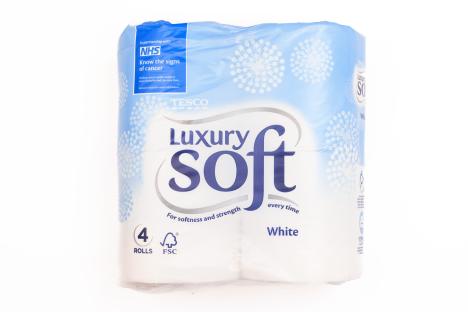 Four rolls of Tesco Luxury Soft white toilet paper.