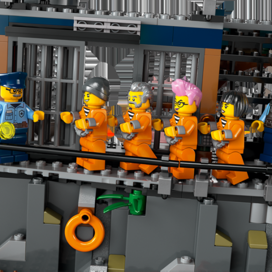 Lego Prison Island set featuring prisoners in orange jumpsuits and a police officer.