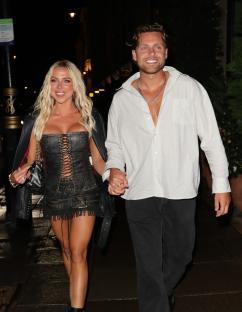 Gabby Allen and Casey O'Gorman holding hands.