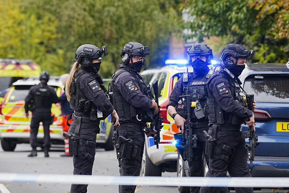 Armed police officers at the scene near the Heaton Park Hebrew Congregation synagogue in Crumpsall, Manchester.