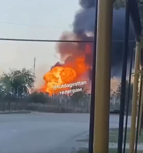 Large fire with black smoke.