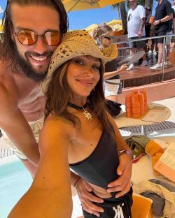 Selfie of a couple by a pool.