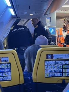 Moment Brit passenger is dragged off Ryanair flight to Corfu after ‘on-board brawl’ diverted plane 600 miles to Italy