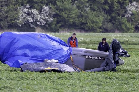 Volunteers protecting a crashed 1940s Spitfire.