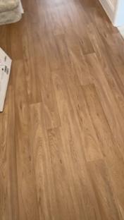 Light brown laminate flooring.