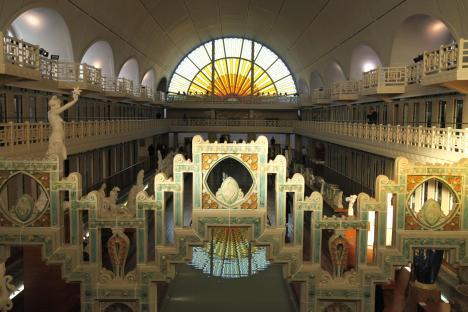 Interior view of the La Piscine Museum of Art and Industry, showing Art Deco architecture and tiled details.