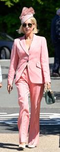 Woman in pink suit and hat at Chester Races.