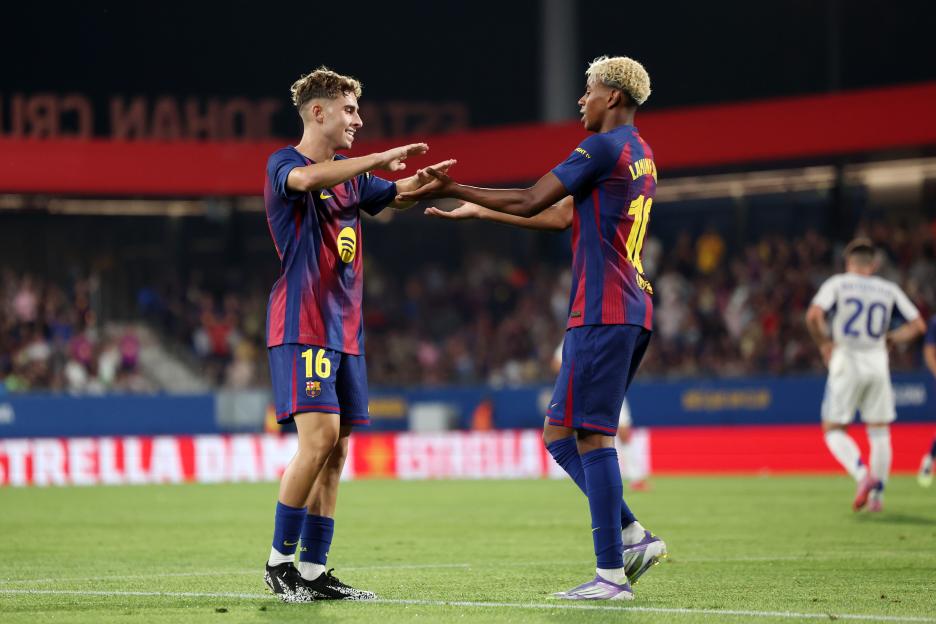 FC Barcelona players Fermin Lopez and Lamine Yamal celebrating a goal.