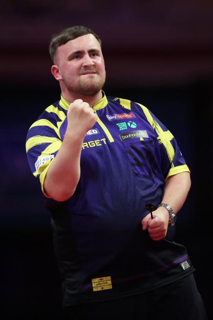 Luke Littler celebrating a dart throw.