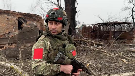 A Russian soldier in a warzone.