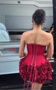 Woman in a red corset dress.