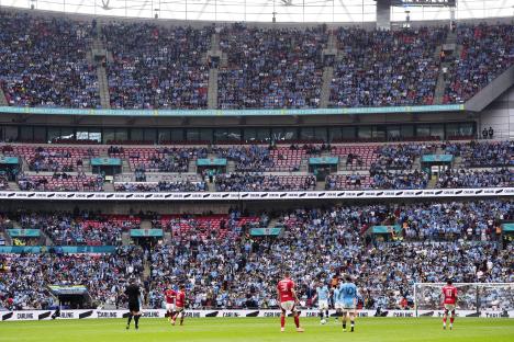 Manchester City supporters in the stands at Wembley Stadium.