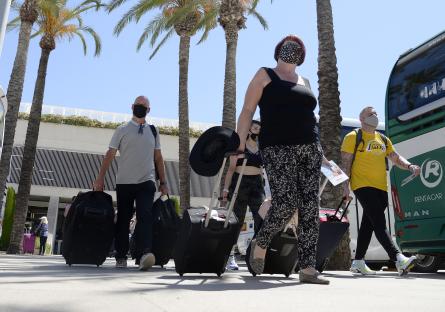 British tourists arrive at Palma airport July 1, after the UK goverment added Mallorca to the green list - meaning UK holiday goers do not need to quarantine on their return home. Pictured: GV: General View Ref: SPL5235741 010721 NON-EXCLUSIVE Picture by: Joan Llado / GTres / SplashNews.com Splash News and Pictures USA: +1 310-525-5808 London: +44 (0)20 8126 1009 Berlin: +49 175 3764 166 photodesk@splashnews.com United Arab Emirates Rights, Australia Rights, Austria Rights, Canada Rights, Denmark Rights, Egypt Rights, Ireland Rights, Finland Rights, Germany Rights, Israel Rights, Jordan Rights, South Korea Rights, Lebanon Rights, Norway Rights, New Zealand Rights, Qatar Rights, Saudi Arabia Rights, South Africa Rights, Singapore Rights, Sweden Rights, Switzerland Rights, Thailand Rights, Turkey Rights, Taiwan Rights, United Kingdom Rights, United States of America Rights