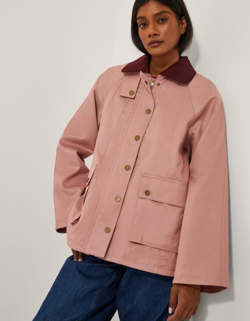 Pink jacket with burgundy collar.