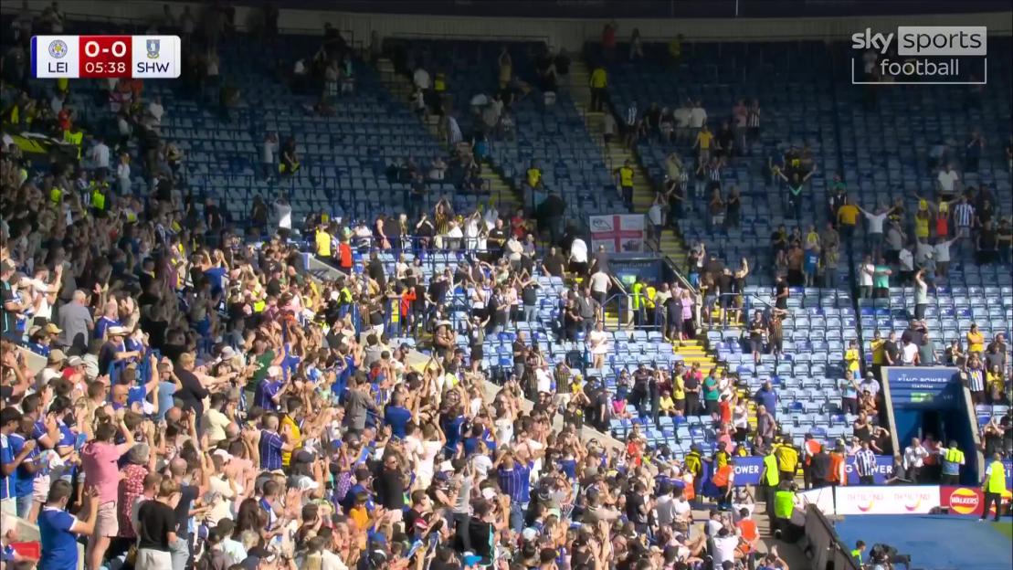 Leicester City fans applaud Sheffield Wednesday supporters protesting financial woes.