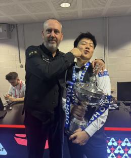 Mark Williams and Zhao Xintong with a snooker trophy.