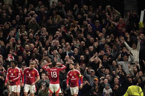 Manchester United players celebrating a goal.