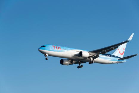 KHP6DF TUI plane in flight at Arrecidfe Airtport Lanzarote, Canary Islands.