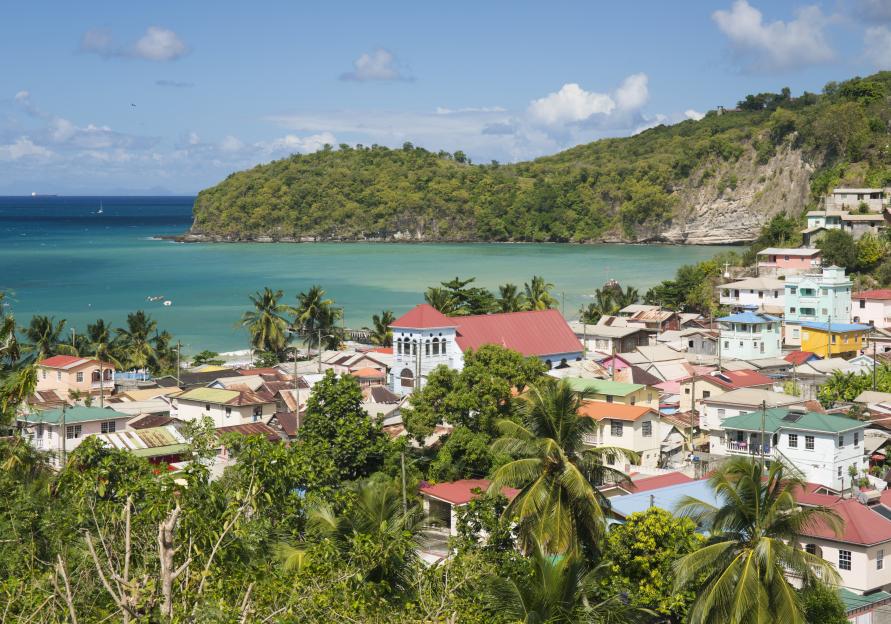 Colorful houses and turquoise water in a Caribbean village.