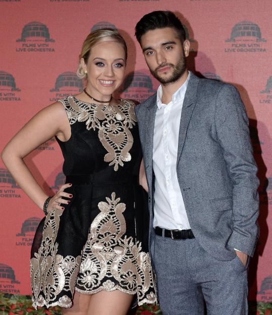 Tom Parker and his wife Kelsey posing.
