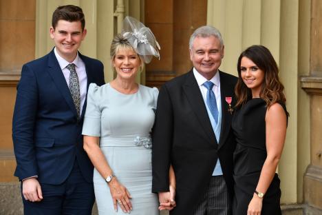 Eamonn Holmes with his family at Buckingham Palace after receiving an OBE.