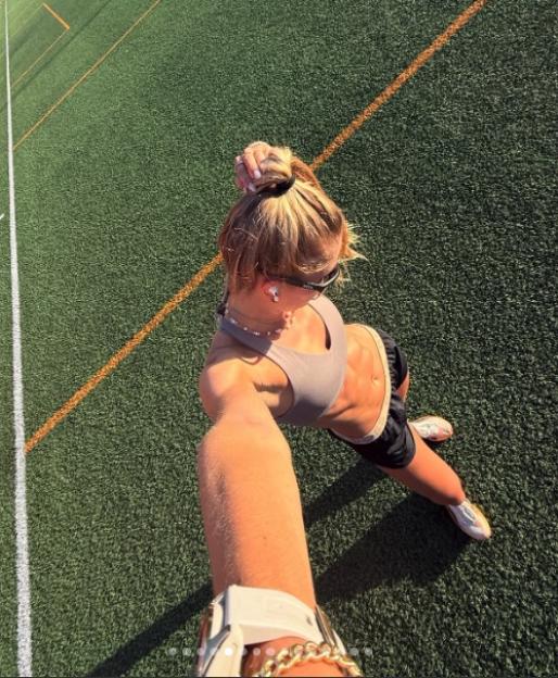 Alica Schmidt standing on a green sports field.