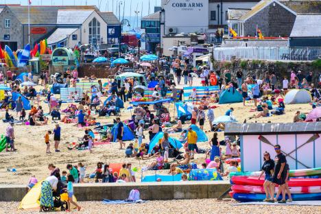 Crowded beach in Lyme Regis, Dorset, UK.